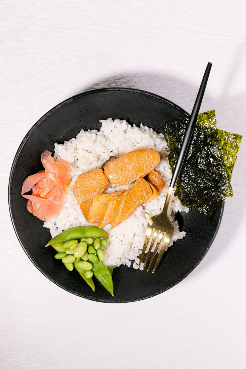 Teriyaki Coho Salmon served over rice with edamame and seaweed
