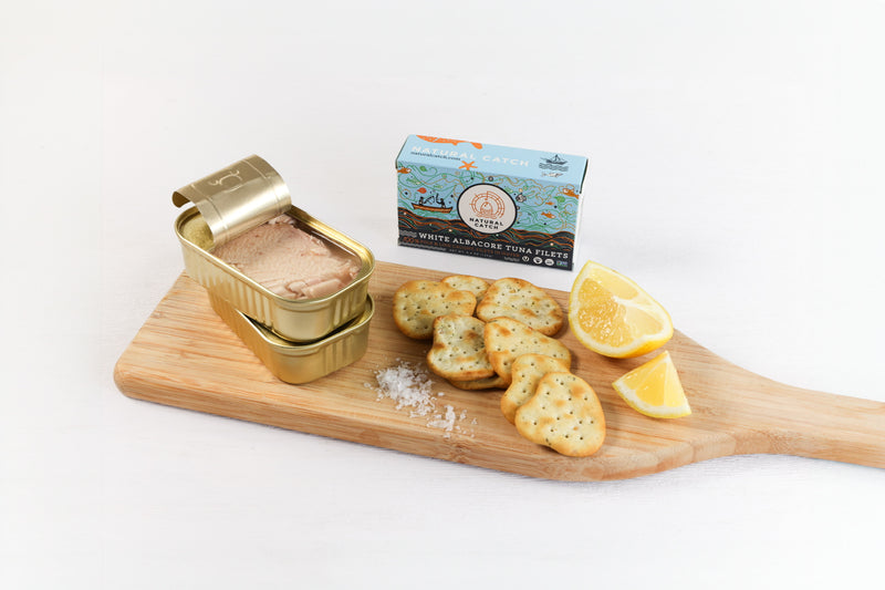 Natural Catch White Albacore in Water served on a board with crackers and lemon