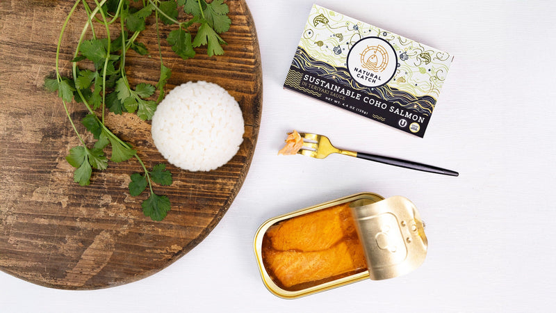 Natural Catch Coho Salmon in Teriyaki Sauce, opened tin and carton beside a scoop of rice and cilantro